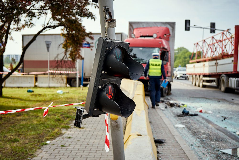 officials cleaning up a trucking accident